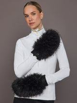 Black leather faux fur mittens on model, front arm view.