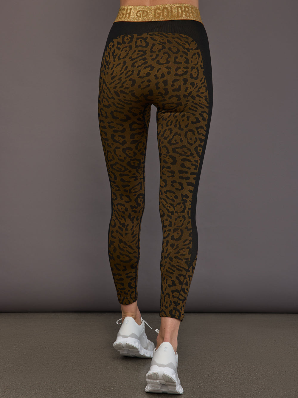 Back view of leopard leggings with gold waistband detail.