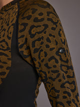 Close-up of leopard knit pattern and sleeve logo detail.
