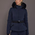 Model wearing navy faux-fur trim ski jacket, front view.