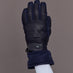 Close-up of quilted leather navy ski glove, top view.