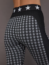 Close-up of black white star seamless baselayer tight, waistband and pattern detail.