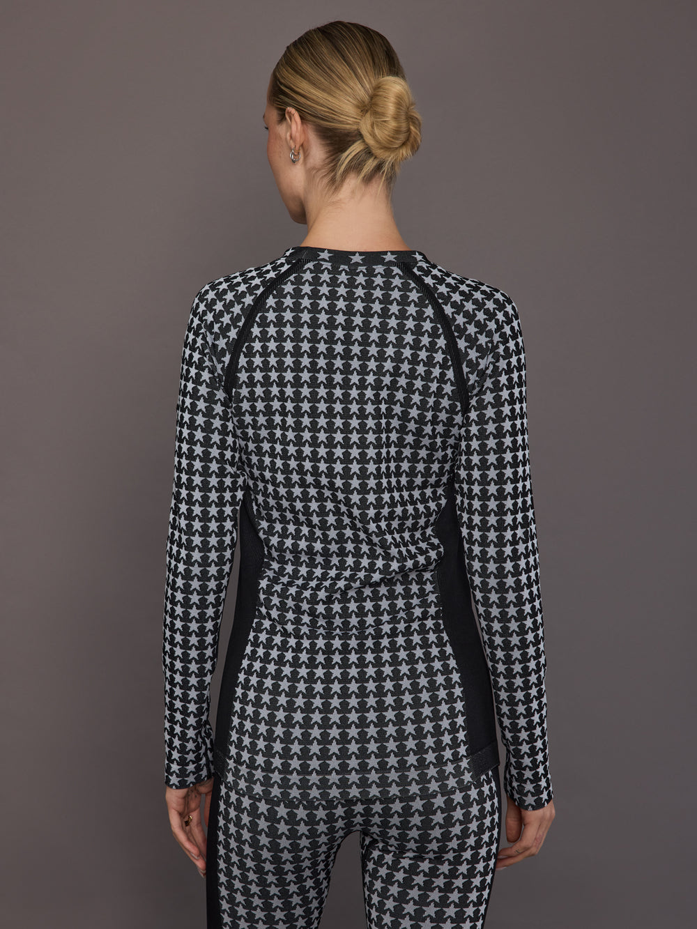 Back view of the Starlet Seamless Baselayer Long Sleeve in Black White Star, showing the star pattern and seamless construction.