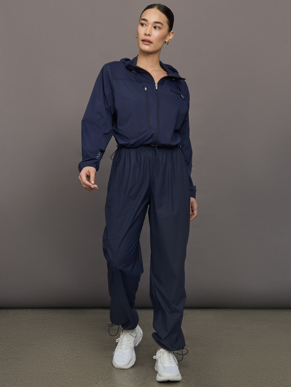 Model wears a pair of Navy joggers.