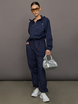 Model wears a pair of Navy joggers.