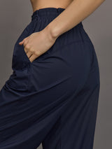 Model wears a pair of Navy joggers.