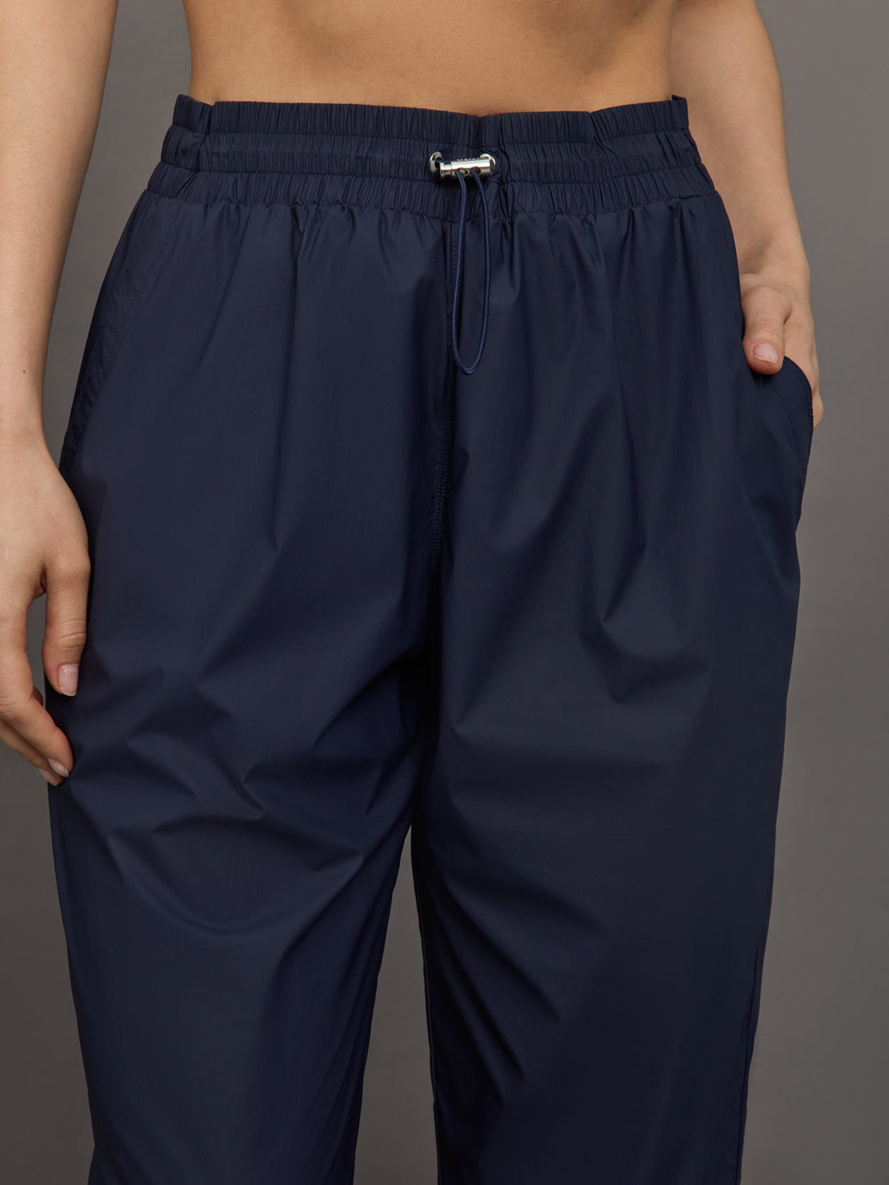 Model wears a pair of Navy joggers.