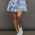 Blue pleated toile patterned skirt with navy waistband.