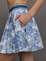 Blue pleated toile patterned skirt with navy waistband.