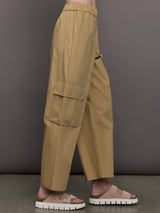 Model wears a pair of mid rise khaki cargo wide leg pants.