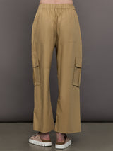 Model wears a pair of mid rise khaki cargo wide leg pants.