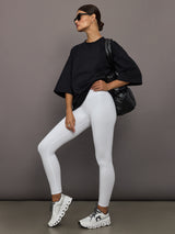 Model wearing a black oversized t-shirt with 'Herskind' text.