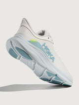 White HOKA running shoe with blue logo and accents on a white background