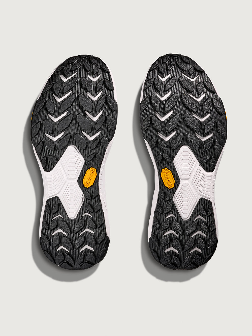 Grey/silver Hoka running shoe.