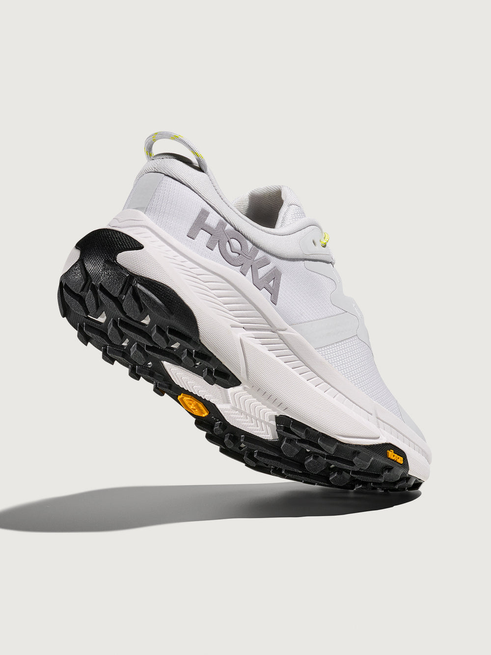 Grey/silver Hoka running shoe.