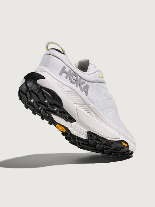 Grey/silver Hoka running shoe.