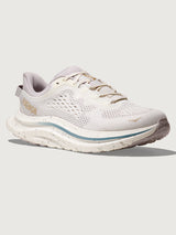 White running shoe with blue accents on a light gray background