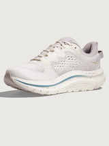 White running shoe with a blue accent on a light gray background
