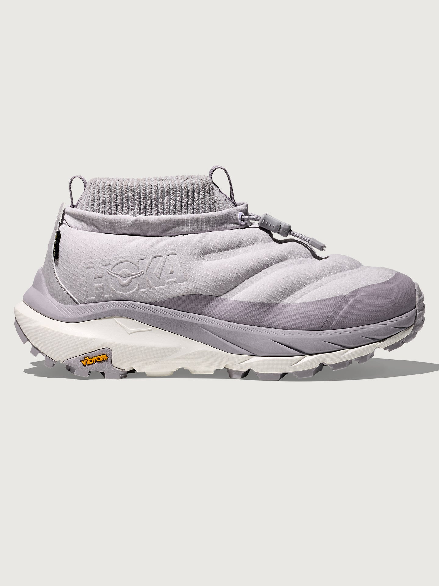 Gray sneaker with white sole on a light gray background