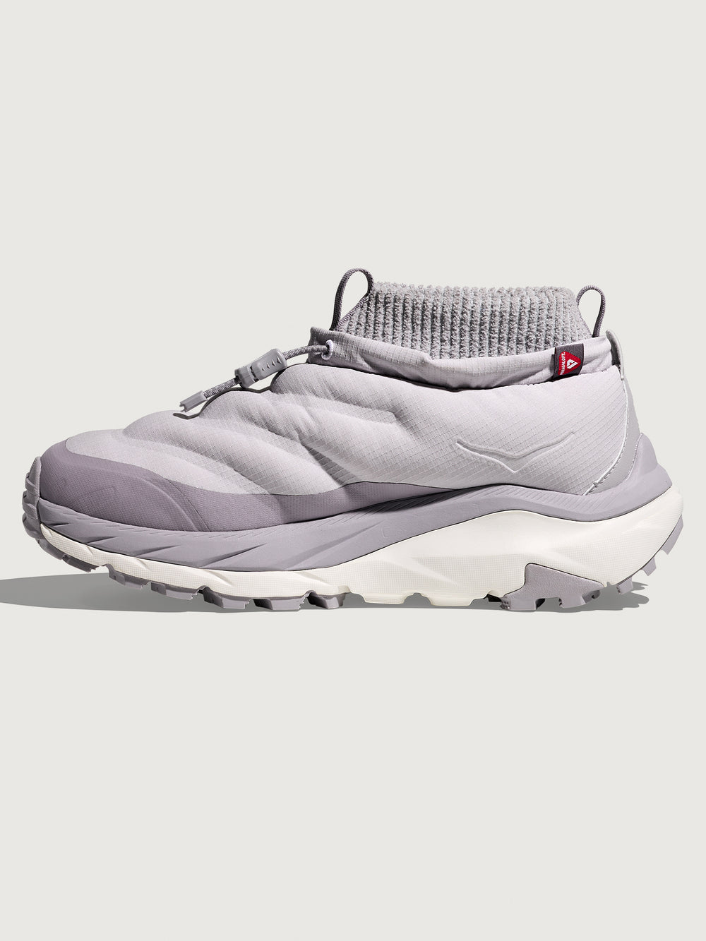 Gray sneaker with white sole on a light gray background