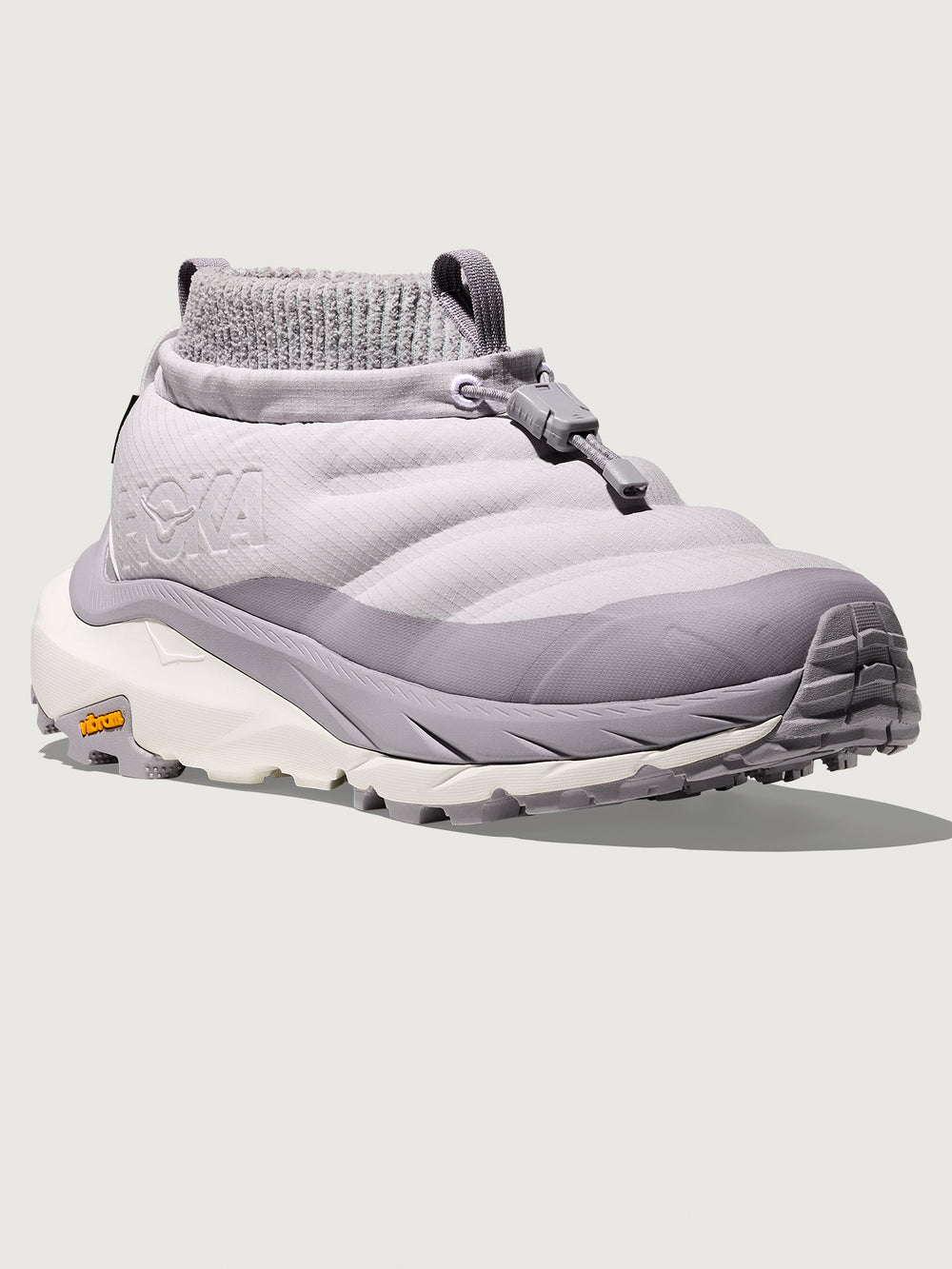 Gray winter sneaker with a textured sole on a light gray background