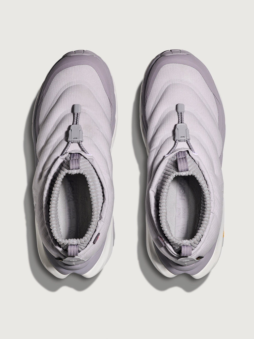 Pair of light purple winter boots on a white background