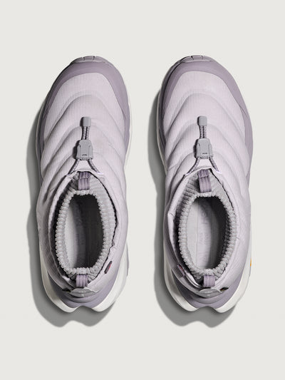 Pair of light purple winter boots on a white background