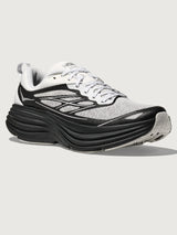 Gray and black running shoe on a light gray background