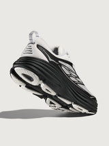 Black and white running shoe on a light gray background