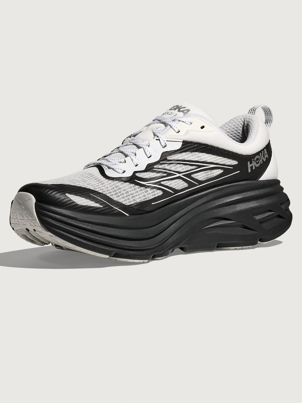 Black and white running shoe on a light gray background