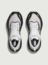 Pair of black and white running shoes on a light gray background