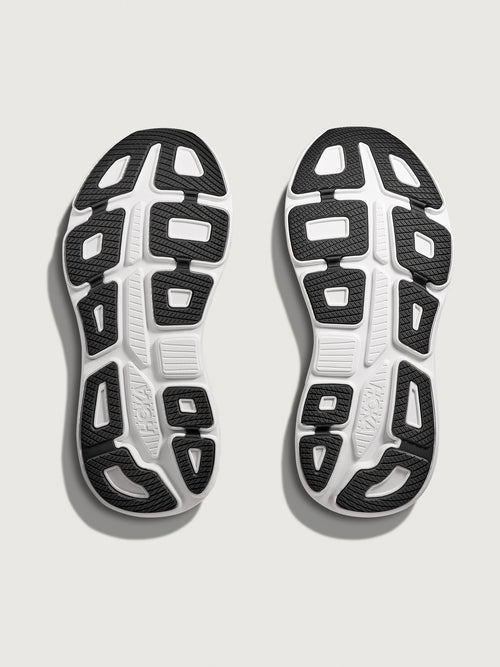Black running shoe with white sole on a light gray background
