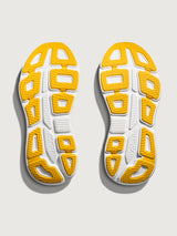Bondi 9 Max Cushion Running Shoe in Alabaster/Birch, outsole view showing traction pattern and rubber coverage.