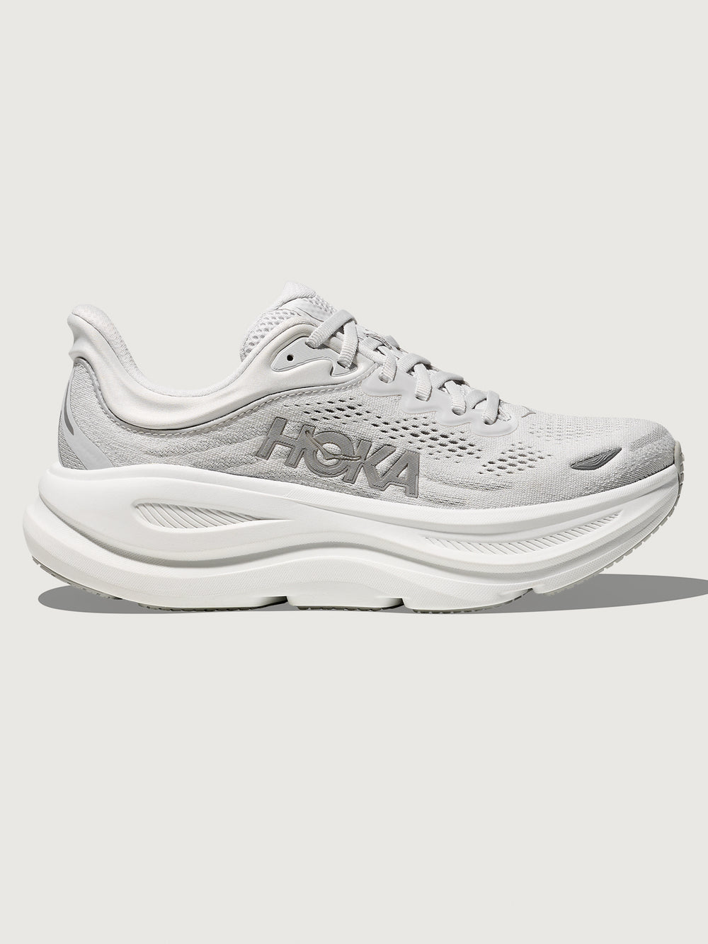 White/grey running shoe with 'Hoka' branding.