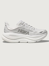 White/grey running shoe with 'Hoka' branding.