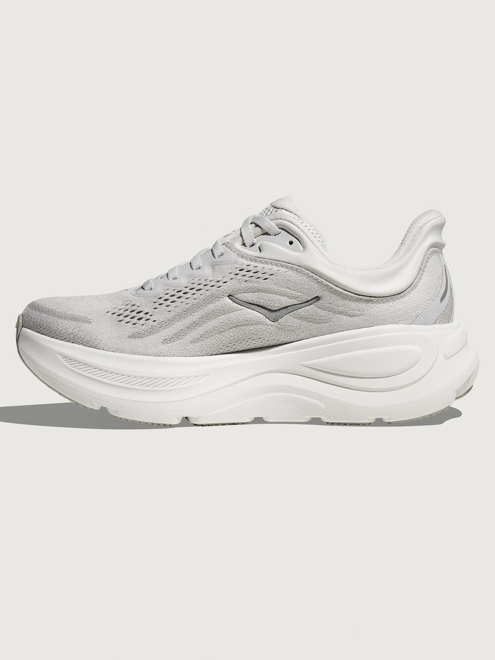White/grey running shoe with 'Hoka' branding.