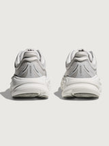 White/grey running shoe with 'Hoka' branding.