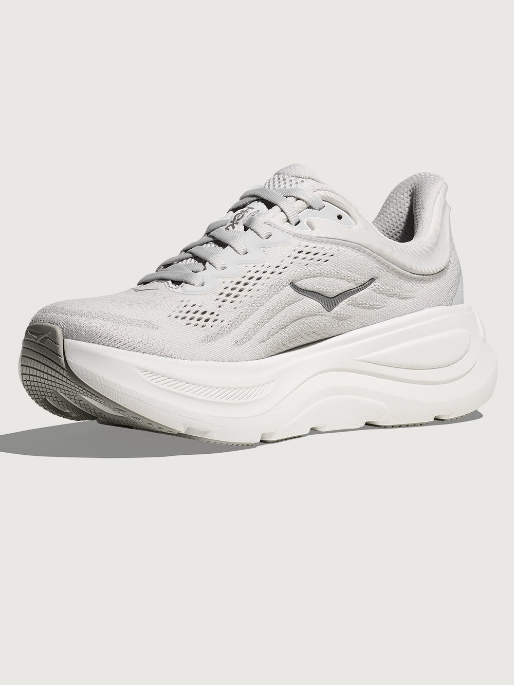 White/grey running shoe with 'Hoka' branding.