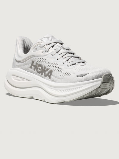 White/grey running shoe with 'Hoka' branding.