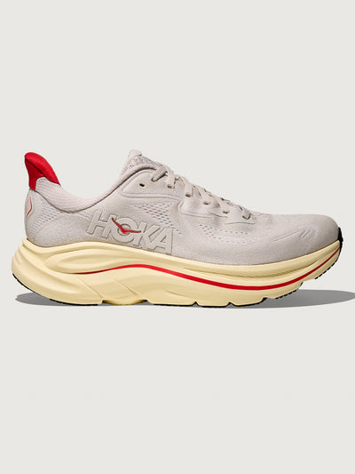 Gray running shoe with red accents with 'Hoka' logo on the side.