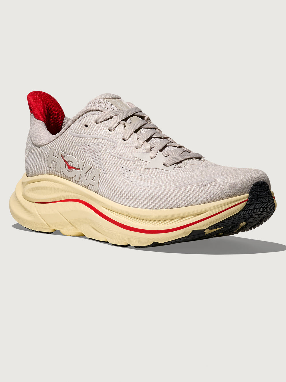 Gray running shoe with red accents with 'Hoka' logo on the side.
