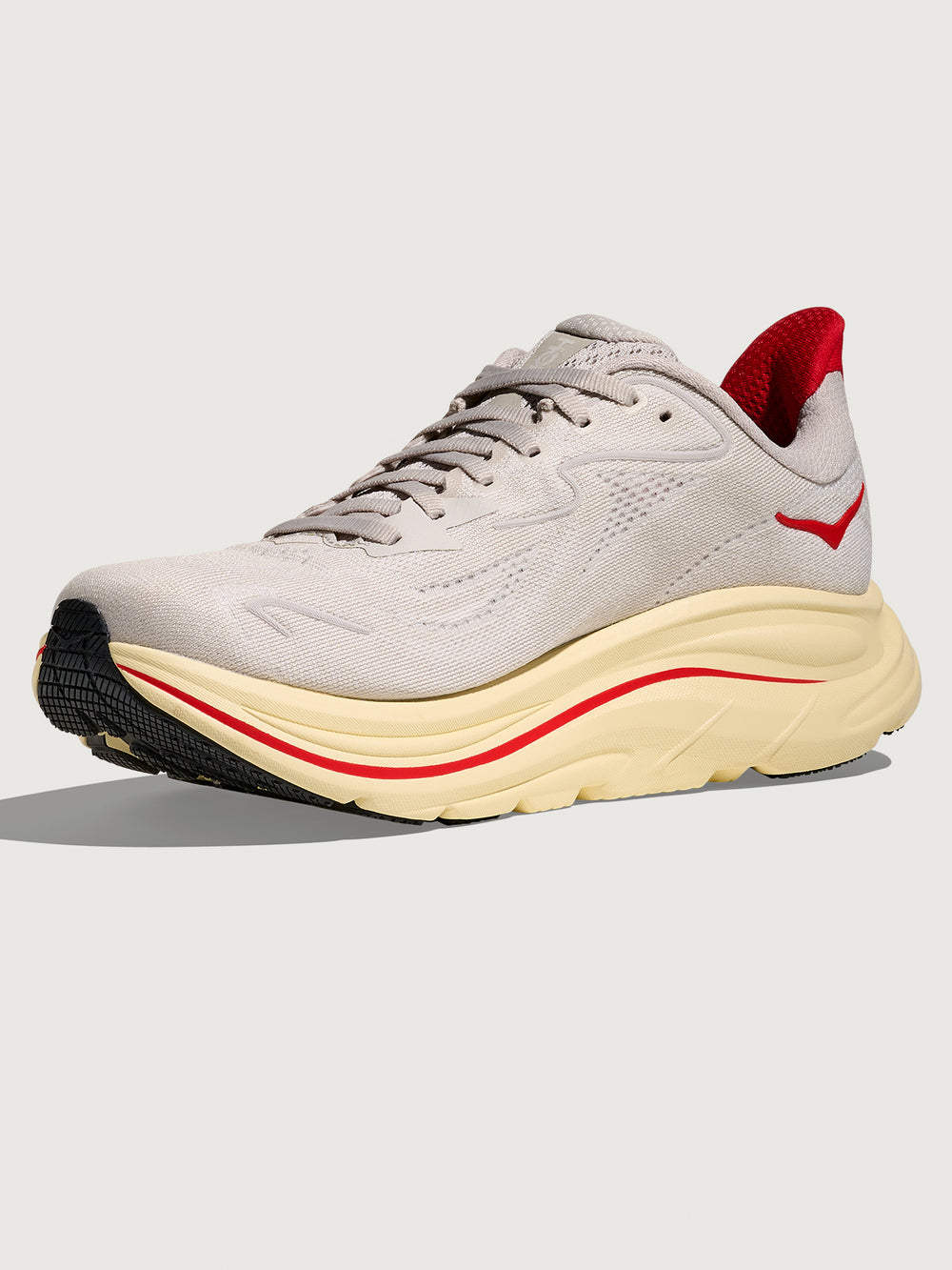 Gray running shoe with red accents with 'Hoka' logo on the side.