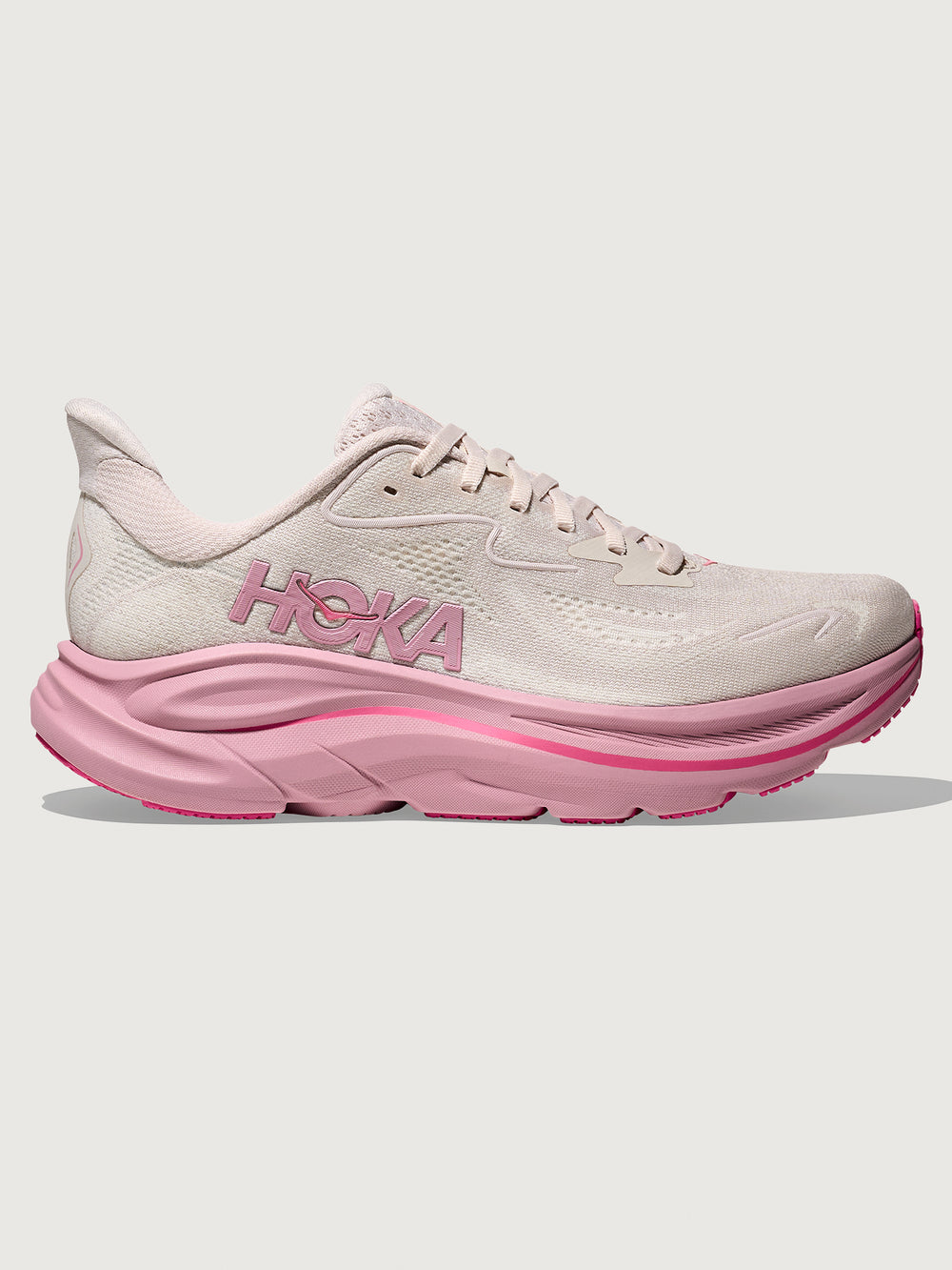 Pink Hoka running shoe with chunky sole.