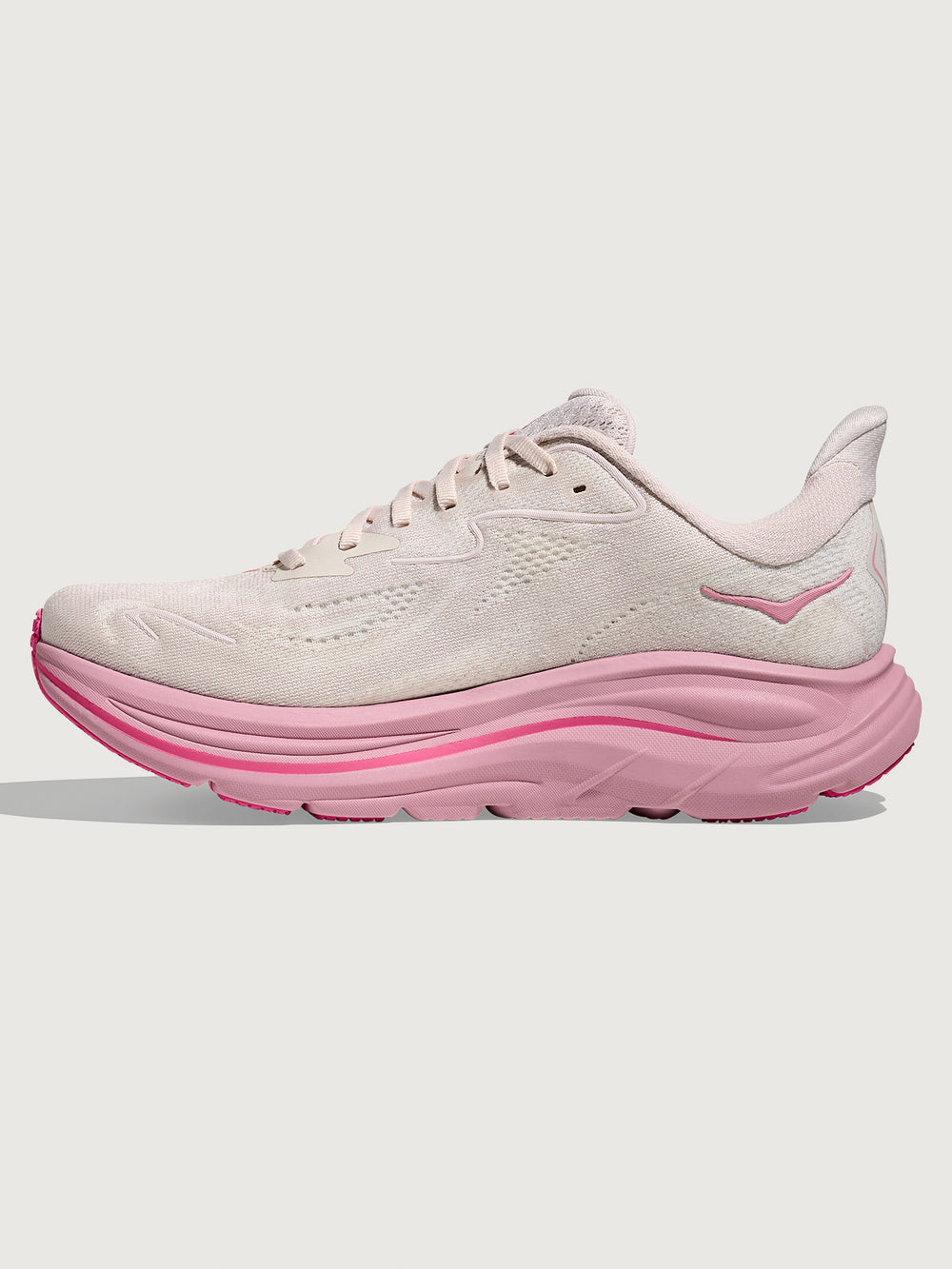 Pink Hoka running shoe with chunky sole.
