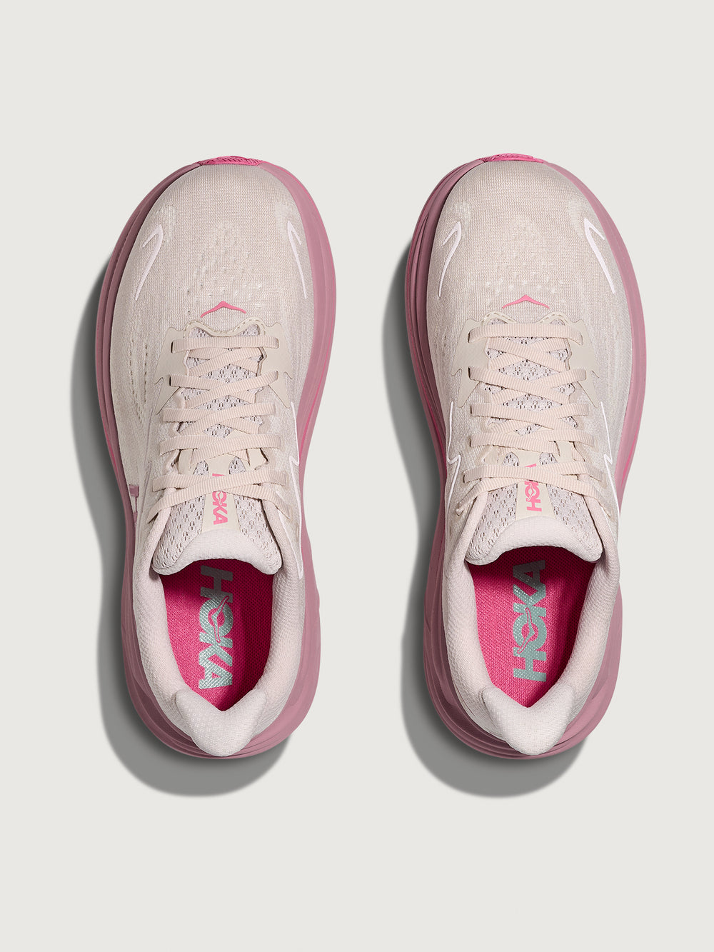 Pink Hoka running shoe with chunky sole.