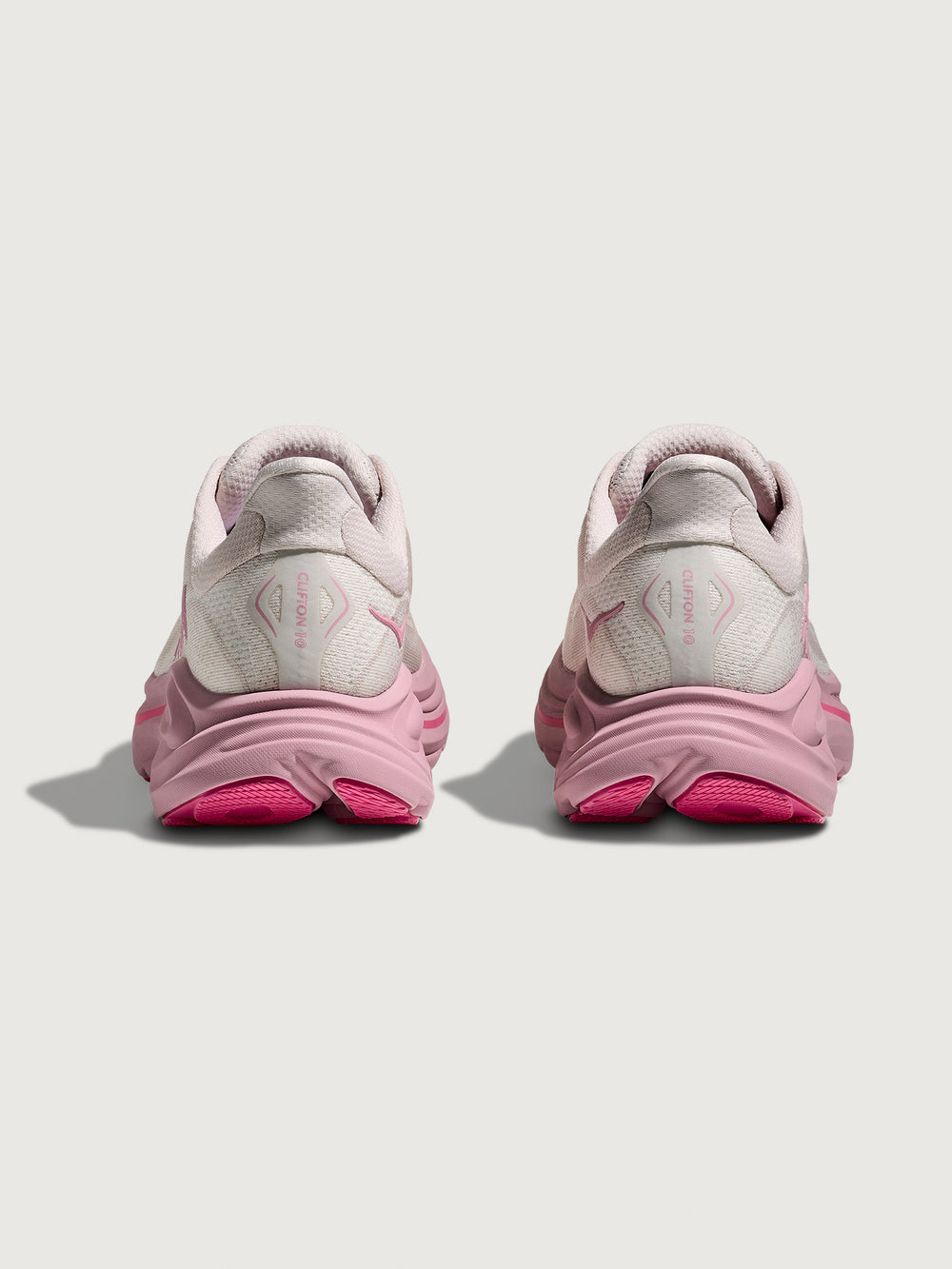 Pink Hoka running shoe with chunky sole.