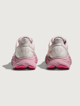Pink Hoka running shoe with chunky sole.