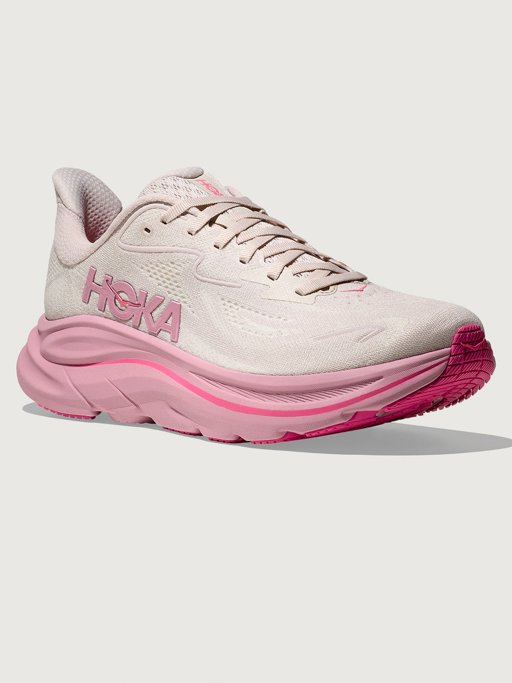 Pink Hoka running shoe with chunky sole.