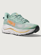 Jade and Grey running shoe with 'Hoka' branding in orange.