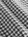 Close-up fabric detail of houndstooth print in black and white.